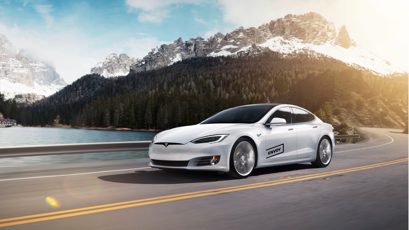 a white car driving outdoors 