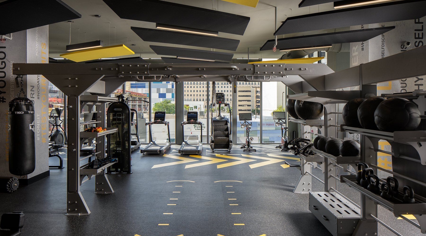 a workout room with exercise machines
