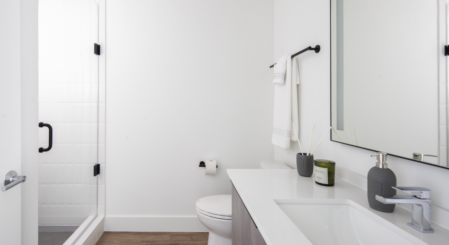bathroom with sink mirror toilet and shower