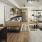 Modern studio apartment interior with kitchen, living, and sleeping areas.