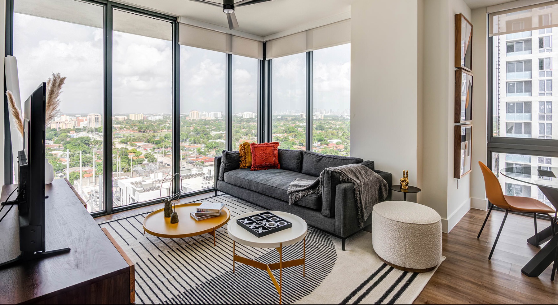 living room surrounded by floor-to-ceiling windows