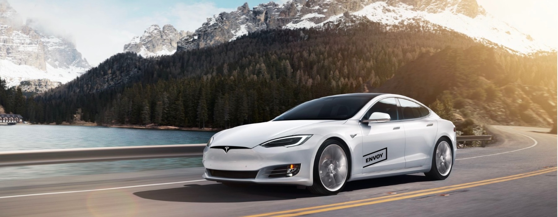 a white car driving outdoors 