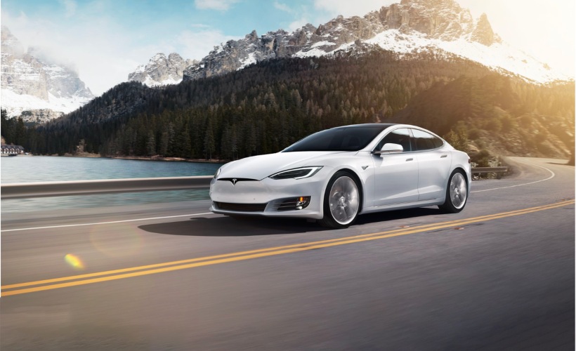 Experience Envoy a white car driving outdoors