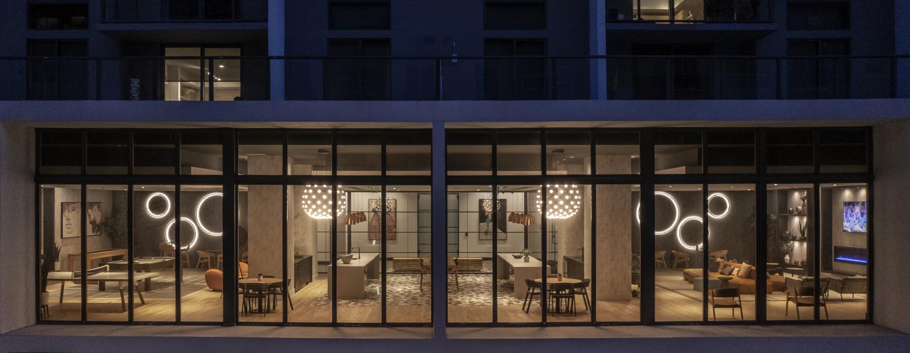 2nd story view through a buildings windows into a lounge