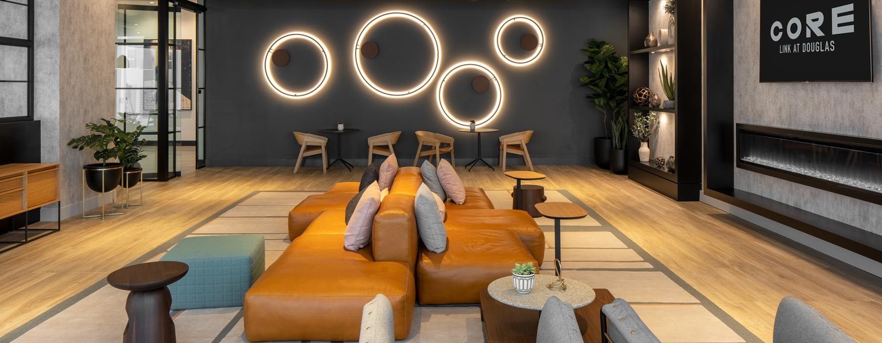 a lounge room with a couch and chairs