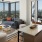 Modern apartment interior with city skyline view.